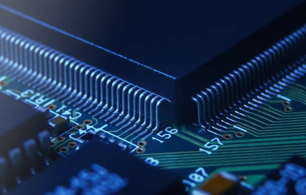 Application-specific integrated circuit in QFP package mounted on PCB